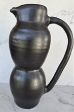 Load image into Gallery viewer, Matte black pitcher with a pointed pulled spout, a curved handle, and a two-tiered bulbous body.