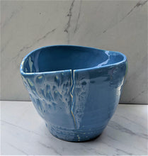 Load image into Gallery viewer, Blue glazed medium lemon-shaped pot with intermittent white glaze and rough clay. Pot does have a significant crack down the side
